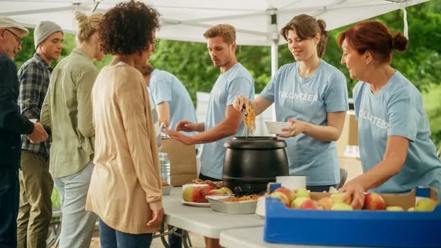 Volunteers serving food at a community event